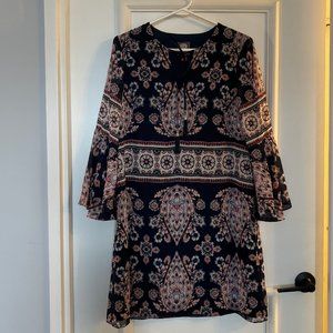 Vince Camuto woven print dress with bell sleeves and front tassels.